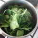 Spinach is added to curry sauce