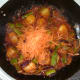 Carrot is grated in to jalfrezi at last minute