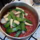 Vegetables are added to spicy curry sauce
