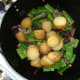 Cooked and cooled potatoes are added to onion and green beans