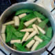 Mangetout and baby sweetcorn are blanched in boiling water