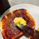 Spread some butter on the jam.