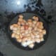 Add oil to a pan. Fry the peanuts till they become crunchy. Set aside.