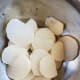 Step 1a: Peel and slice the daikon radish.