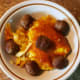 Serve generous spoonfuls of cheesy noodles and top with six meatballs per bowl.
