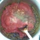 Tomatoes, chilli and seasoning are added to cooked onions