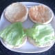 Lettuce beds are laid on toasted rolls