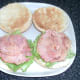 Bacon is laid on chickpeas and lettuce
