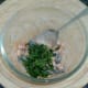 Coriander is stirred in to spiced chickpeas