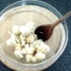 Cauliflower florets are turned in seasoned oil