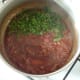 Coriander leaf is added to curry sauce