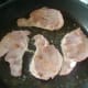 Bacon is gently fried in oil