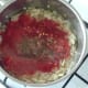 Tomatoes, chilli and seasonings are added to softened onion