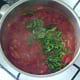Coriander/cilantro is added to tomato sauce
