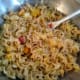 Gently fold the drained fruit cocktail and the crushed pineapple into the noodle and egg mixture and combine the ingredients together well.