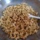 Add the egg noodles to the egg mixture and blend together until the noodles are glossy.