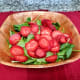 Add the sliced strawberries to the salad.