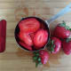 Remove the stems, rinse and slice the strawberries.