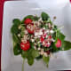 You can add the dressing and crumbled cheese to each individual salad plate if you prefer.