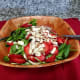Add the sliced almonds to the salad, then gently combine the ingredients together.