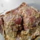 2# chicken marinating in a mixture of yogurt and masala paste