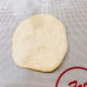 Using a rolling pin or your palms, flatten each portion into 1/4 inch thickness. I used my hands.