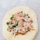 Spoon about a tablespoon of the tuna mixture in the center of the dough.