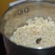 Drain it completely. Grind it to make a near-smooth thick paste.