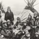 Sami people in Norway in front of two Lavvo Tents around AD 1920.
