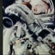 Onboard camera photographs John Glenn while in orbit. Photo courtesy of NASA.