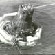 Sigma 7, with flotation collar attached, awaits recovery. Photo courtesy of NASA.