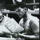 Wally Schirra reviews the flight plan for his mission. Photo courtesy of NASA.