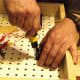 Screwing in the knife switch.