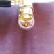 A close up of a lighted bulb. Electrical energy has been converted to light energy by this bulb.