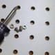 Screws and nuts with appropriate screwdriver for screw heads.