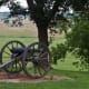 Confederate cannon facing the Union advance on the field below the ridge of Confederate defenses. "Crawford's Prairie"
