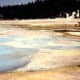 One is told to stay on the wooden raised passageways in Yellowstone.