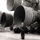 Von Braun in front of the Saturn V rocket engines the most powerful ever built a product of his creation they would land man on the moon.