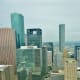 Note height difference of Niels Esperson Building (middle of picture to the right) compared to surrounding skyscrapers. Photo taken from high up in the former location of the Petroleum Club in downtown Houston.