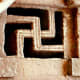 A swastika shaped window frame in an 12th-13th century rock-cut chuirch in the town of Lalibela, in Ethiopia