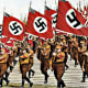 A Nuremburg rally. By 1930 when this photo was taken, the swastika flag was everywhere in Nazi news reels - it had became a symbol for everything they stood for. The notoriety could only grow