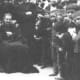 Don Bosco, near the end of his life, with persons who would help carry on his work.