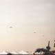 A C-130 during a mass parachute drop, Andrews AFB, MD.