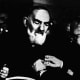 Padre Pio receives a medal for his humanitarian efforts.