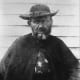 Fr. Damien in his final months; his injured right arm is in a sling.