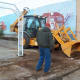 Ripping out planters and other fixtures inside the Poteau Pocket Park (Town Square)