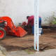 Ripping out planters and other fixtures inside the Poteau Pocket Park (Town Square)