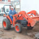 Ripping out planters and other fixtures inside the Poteau Pocket Park (Town Square)
