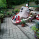 The memorial surrounded with the plants Tony has bought and tended.