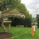 Amargasaurus and the back of the Immigrant's Memorial Monument